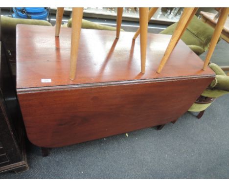 A 19th century mahogany dining table having drop leaf top on square gate legs