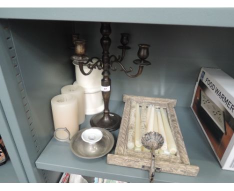 A selection of modern candles and candlestick holders