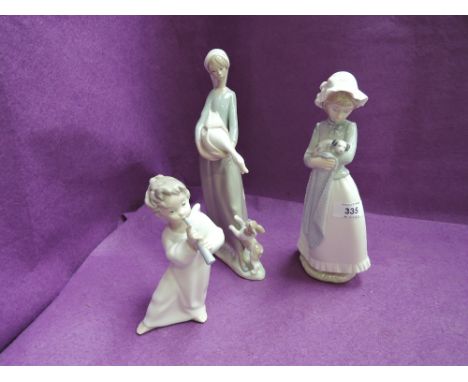 A Lladro figurines, Angel playing Flute, A Nao figurine Girl with Puppy and a similar figurine, Girl with Duck and Dog