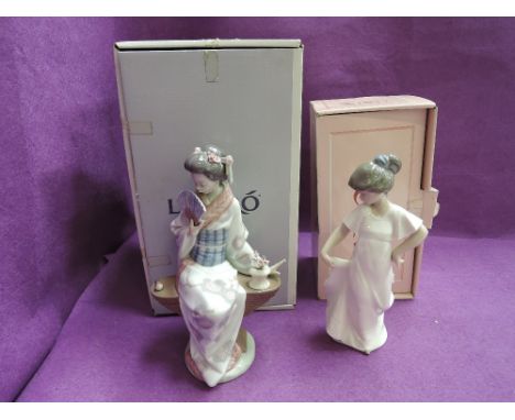 A Lladro figurine, Nippon Lady 5327 (af), boxed and a Nao figurine, Girl Dancing, boxedCONDITION REPORTFinger damaged and flo