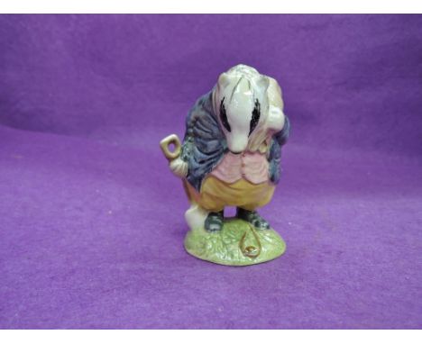 A Beswick Beatrix Potter figure, Tommy Brock, spade out, variable eye patch BP2