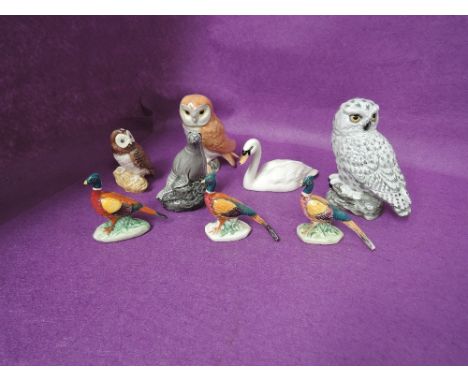 Seven Beswick studies, Pheasants 767A & B, Swan 1684, Tawny Owl 3272, Owl 2026 Whisky Flask Otter and a Mack study, Snowy Owl