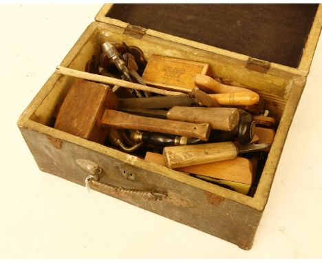 A large collection of woodworking tools, mallet, planes, etc