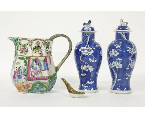 A Canton jug, with a restored handle, a spoon, and a pair of Chinese prunus vases and covers, 21cm high