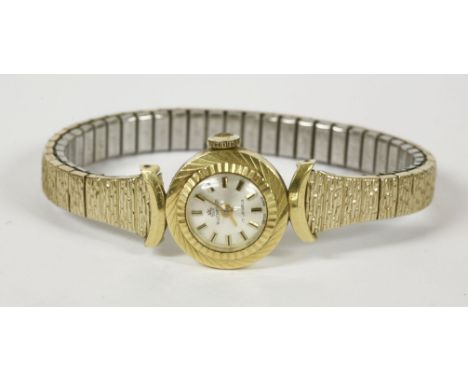 A ladies Bucherer mechanical watch head, with silver dial, baton numerals and diamond cut bezel, on crescent lugs, on later e