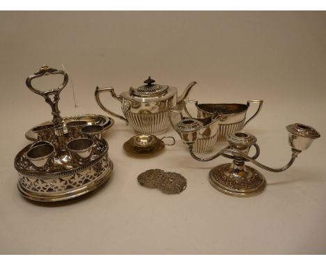 A collection of miscellaneous plated items including a tea service, an entree dish, an egg cruet set, a three light candelabr