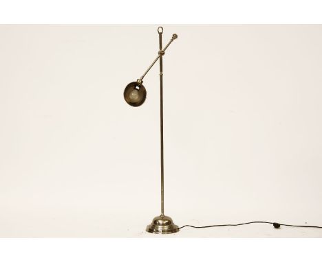 A polished metal reading lamp