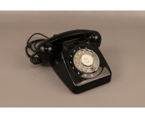A black vintage rotary dial telephone  