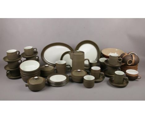 A collection of Denby Greenstone tea and coffee sets, coffee pot, milk jug, cups and saucers etc  