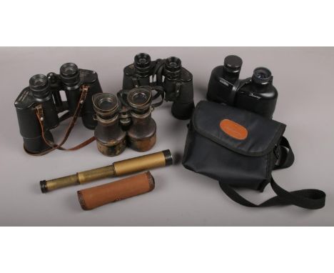 An Embeeco telescope with canvas case along with a quantity of binoculars to include Halina, Prinz, etc.  