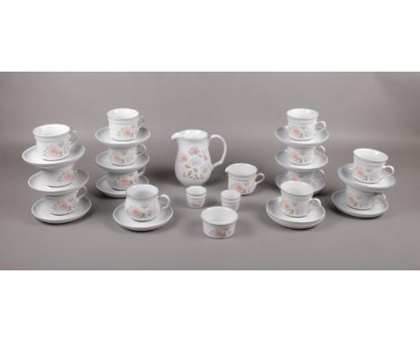 A Denby Dauphine tea service, cups, saucers, milk jug.  
