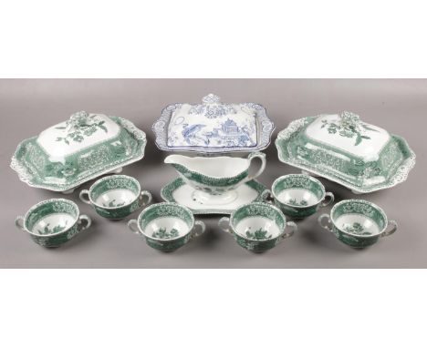 A collection of Spode tea and dinnerwares in the Green Camilla design, along with a blue and white tureen.  Blue and white tu