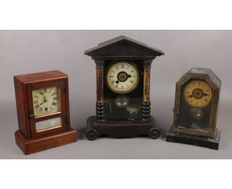 Two American alarm clocks along with a mahogany cased mantel clock.  