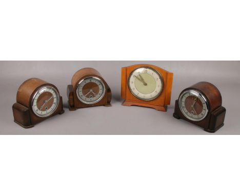 Three oak dome top Bentina mantel clocks along with another Bentina mantel clock.  