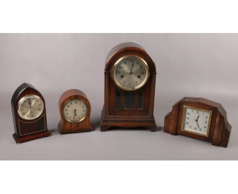 Four wooden mantel clocks to include, a Duke U.M wind up clock, and a French made art deco style mantel clock etc.  The large