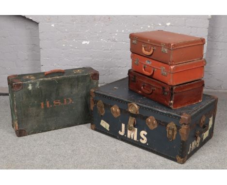 A vintage travel trunk, along with four vintage suitcases, to include W Heather example.  