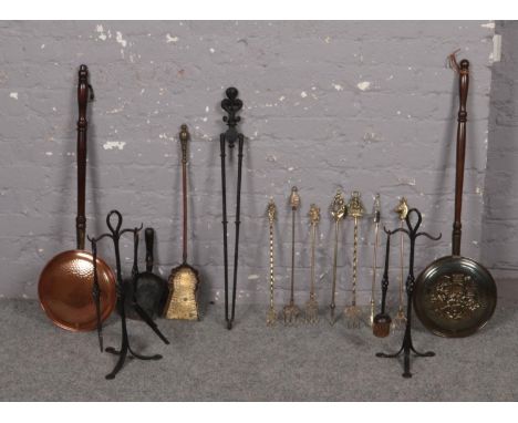 A group of mainly brass fire compendium tools, coal shovel, fire brush etc to include two copper bed warmers  