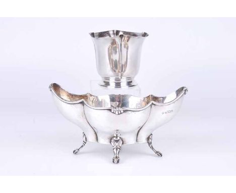 An Edwardian silver boat shaped dish, London1907 by Josiah Williams &amp; Co, together with a lobed and footed base, London 1