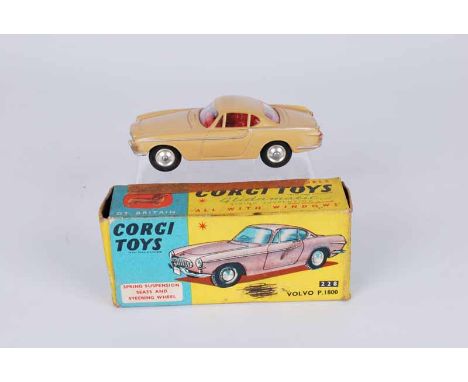 A vintage Corgi Toys 228 Volvo p.1800 in beige finish in original box [box with repairs and writing]