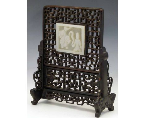 Chinese mutton fat jade table screen carved with a kirin and a sage, within a rosewood key pattern frame, in its matching sta