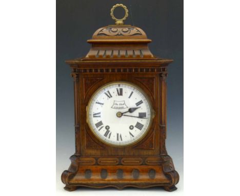 German walnut cased bracket clock, early 20th century, the bell-topped case with fretwork sides, Roman dial named by the reta