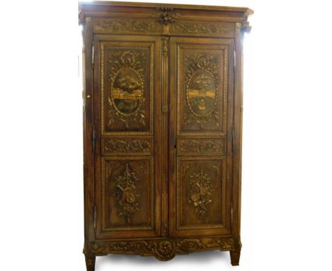 19th century French walnut armoire, pediment with rams heads, baskets of flowers and trailing festoons, four panel door with 