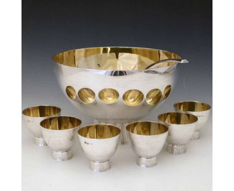 Modernist design silver gilt punch bowl, ladle and six cups, CJ Vander Ltd, London 1973, 1974 and 1971, each semi ellipsoid b