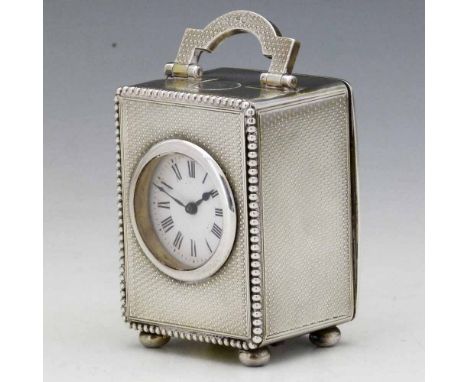 Miniature silver cased carriage clock by C&amp;G Asprey, London 1907, with guilloche decoration, white enamel dial and French