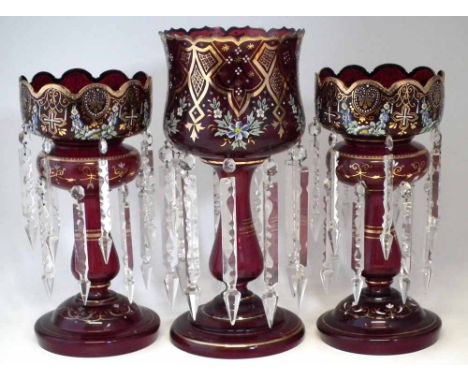 Pair of Victorian ruby glass lustres and one other taller forming a composed Garniture, with enamelled and gilt decorations, 