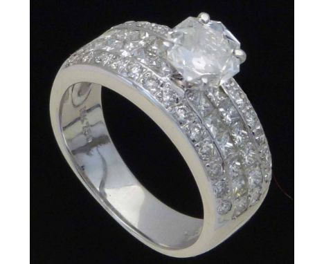 Octagonal diamond, 0.54ct in a raised setting on princess shoulders in 750 white gold, ring size K, gross weight 5.6g