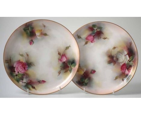 Pair of Royal Worcester plates, painted with roses, script H for Hadleys mark and date codes for 1907 to bases, (2) 23cm diam
