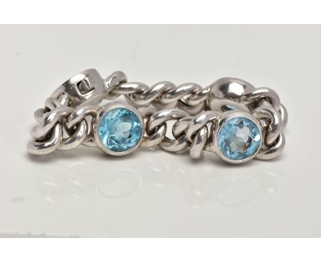 A BLUE TOPAZ CHAIN BRACELET, white metal curb chain bracelet with three circular cut topaz stones in a bezel setting, approxi