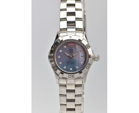 A LADY'S TAG HEUER AQUARACER WRISTWATCH, a polished steel watch, rotating bezel with a blue mother of pearl face, Arabic numb