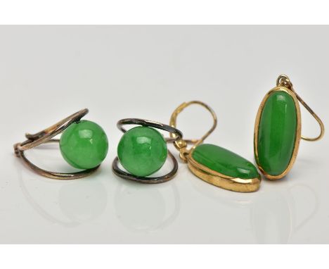TWO PAIRS OF GREEN HARDSTONE EARRINGS, the first of an oval form, set with an oval green stone cabochons, within yellow metal