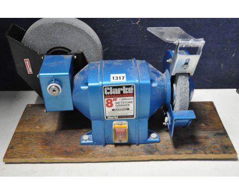A CLARKE CBG8W wetstone bench grinder (PAT pass and working) along with a Clarke S60 metalworking bench grinder stand on whee