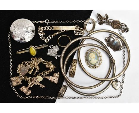 A PARCEL OF SILVER AND WHITE METAL JEWELLERY, to include a silver charm bracelet, suspending seven charms in forms such as a 