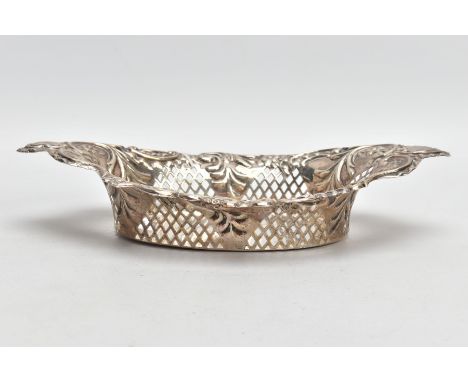 A LATE VICTORIAN SILVER PIERCED BONBON DISH, of an oval form, embossed floral design, two vacant cartouches, approximate dime