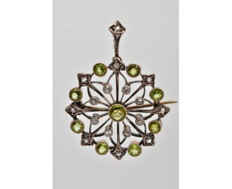 AN EDWARDIAN PERIDOT AND DIAMOND PENDANT/ BROOCH, nine circular cut peridots set amongst a pattern of eight old cut diamonds 