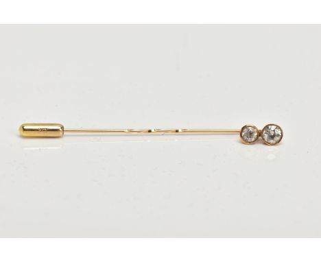 A DOUBLE DIAMOND STICK PIN, two old cut diamonds bezel set in a yellow metal, estimated total carat weight 0.53ct, approximat