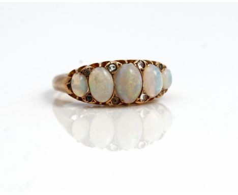 A late Victorian 9ct gold and opal five stone ring, mounted with a row of opals graduating in size to the centre, Birmingham 