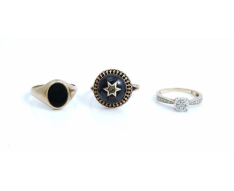 A 9ct gold and diamond cluster ring, with diamond set shoulders, ring size K and a half, a 9ct gold and oval black onyx signe