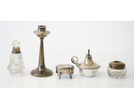 Silver and silver mounted wares, comprising; a table lighter, Birmingham 1924, weight 68 gms, one candlestick, a glass hair t