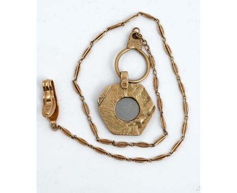 A 9ct gold mounted Dunhill slide action cigar cutter, of hexagonal form, having a textured finish, London 1967, with a gold m