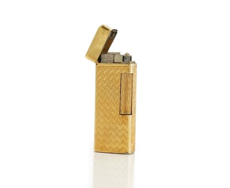 A gold rectangular cased gas lighter, the exterior engine turned and detailed 18 K Italy.