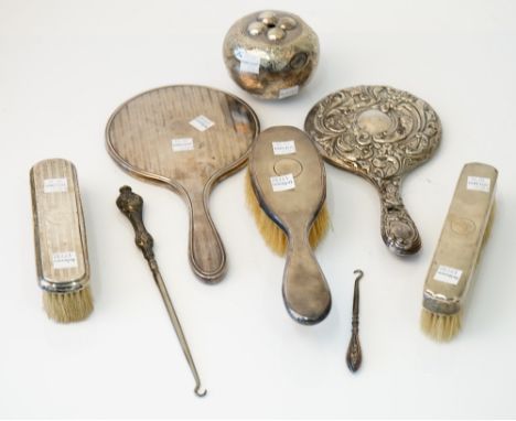 Silver and silver mounted wares, comprising; a hand mirror, Birmingham 1922, another hand mirror, a hairbrush, two clothes br