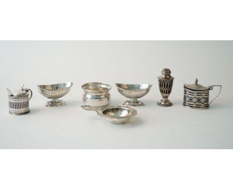 Silver, comprising; an oval mustard pot, Chester 1899, another mustard pot, London 1893, with two blue glass liners, a mustar