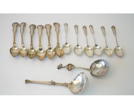 A set of six silver teaspoons, having decorated handles, Sheffield 1911, a set of six European thread pattern teaspoons, a Du