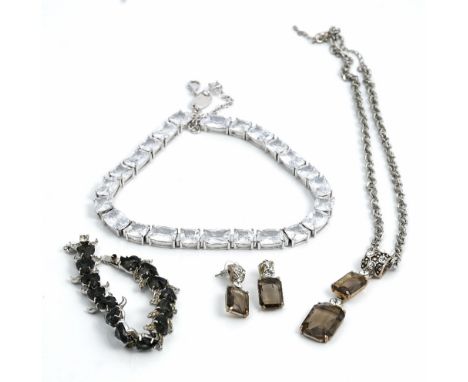 A Christian Dior by Mitchel Maer blue and colourless paste bracelet, a Newbridge colourless gem set necklace, a pale brown an