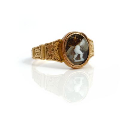 A Victorian gold and oval cameo ring, the mount decorated with engraved tapered panels, (the central cameo badly damaged), ci