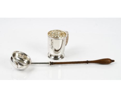 A silver Christening mug with a C shaped handle, Birmingham 1981, weight 138 gms, a pair of European butter dish stands, each